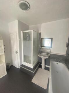 Bright bathroom with separate bath and shower...