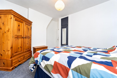 Bright Modern Bedroom with Geometric Duvet.png