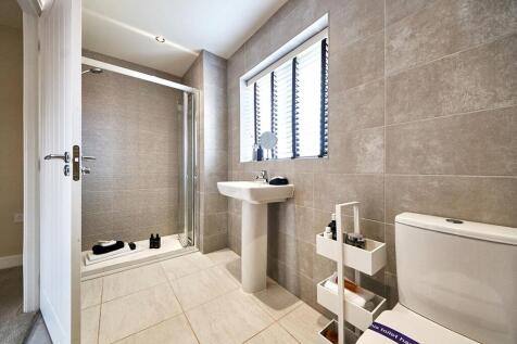 The main bedroom boasts its own en suite shower room