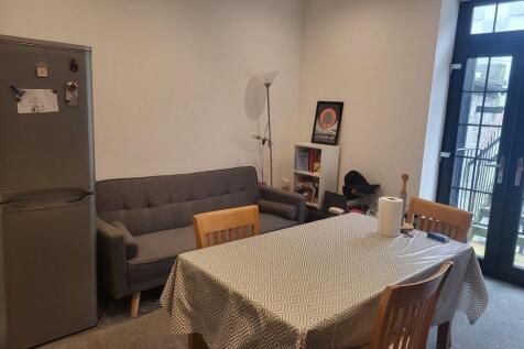 Bright, neatly presented living/dining area wit...