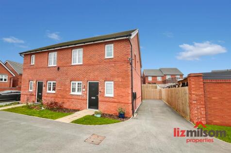 FRONT EXTERNAL BLUE SKY.JPG