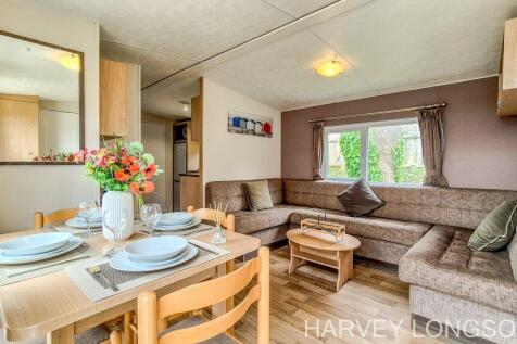 Open plan lounge and dining area inside the Delta 