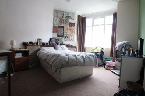 A cozy bedroom featuring a double bed, natural ...