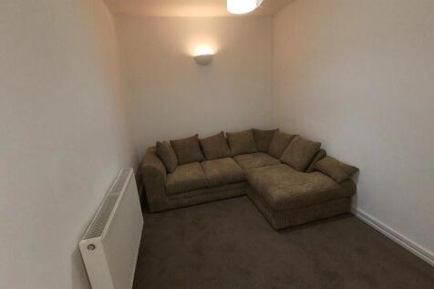 Cosy lounge featuring a large corner sofa...
