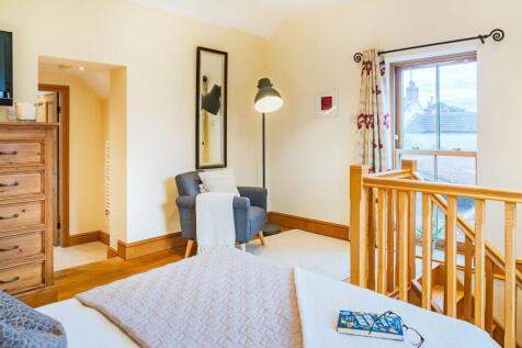 Ascend the private staircase to the annexe bedroom