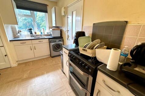Bright kitchen with ample workspace and storage...