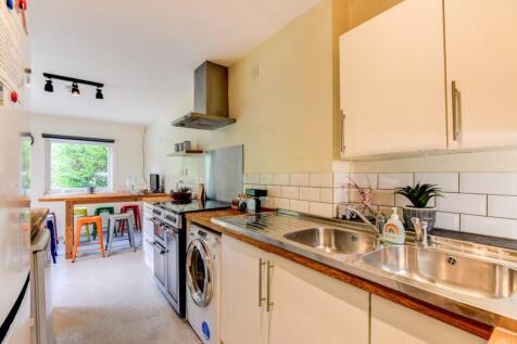 Bright and welcoming kitchen with modern applia...