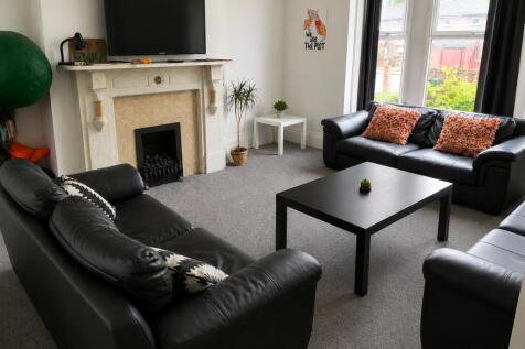 Bright, spacious lounge with comfy leather sofa...