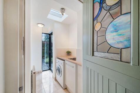 Utility Room with access to the back courtyard.