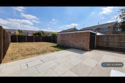 Garden With Newly Laid Patio And Garage