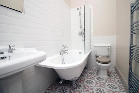 Elegant bathroom suite with roll top bath...