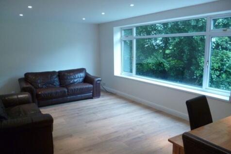 Bright, modern living room with wide picture wi...