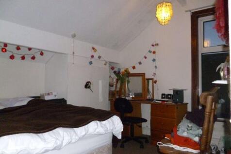 A welcoming bedroom featuring a comfortable dou...