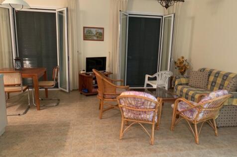 living area with doors to balcony