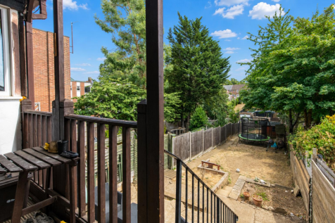 Sunny garden decking with clear blue skies.png