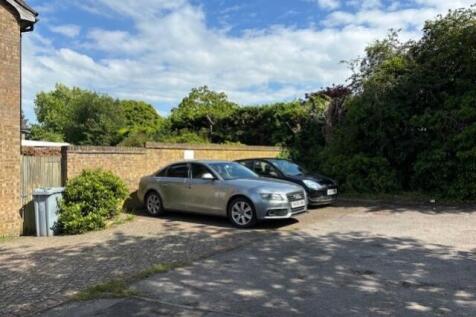 Parking space with silver car