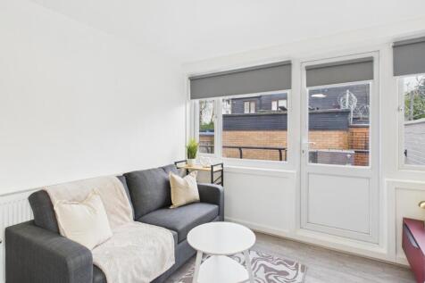 Bright, modern living room with a comfortable d...