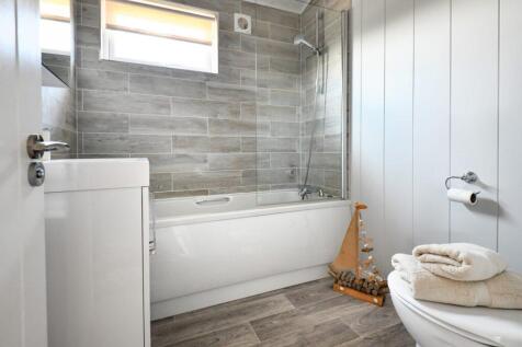 Modern Family Bathroom With Bath And Overhead Show