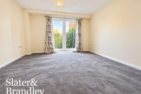 Bright Neutral Room with Balcony Doors