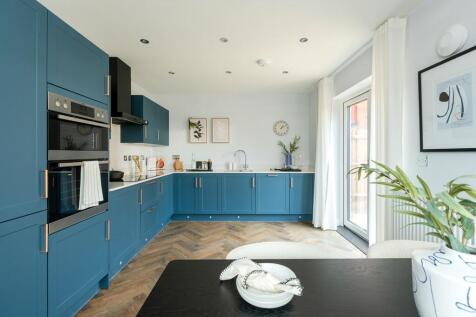 A stylish kitchen diner with double doors to the garden