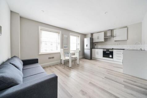 Bright open-plan kitchen with modern appliances...