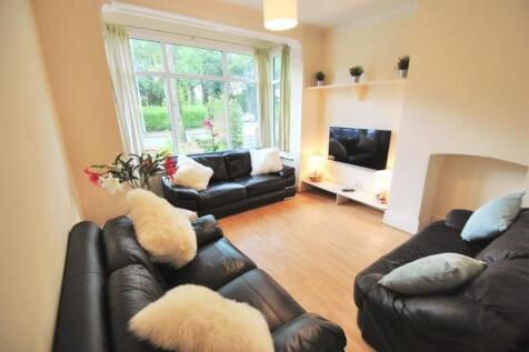 Bright and airy living room with stylish sofas...