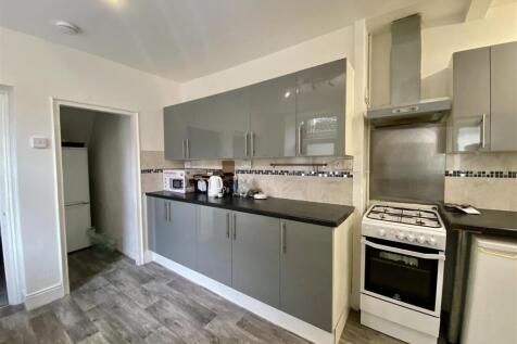 Modern kitchen with stylish grey gloss cabinets...