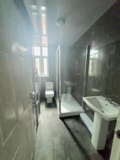 Modern bathroom with sleek grey tiling...