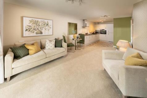 a living room with white couches