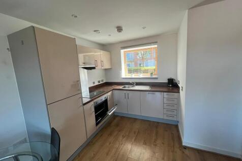 Modern fitted kitchen with bright natural light...
