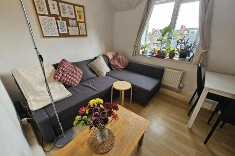 Bright and welcoming living room featuring comf...