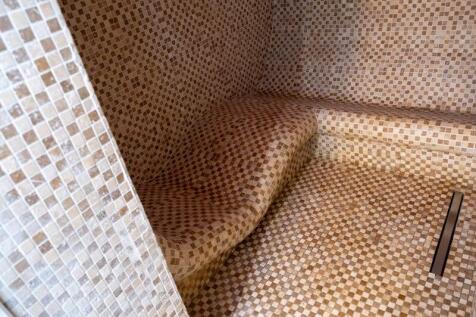 Heated marble spar lounger in shower