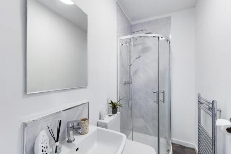 A modern and clean bathroom featuring a stylish...
