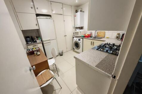 Fully equipped kitchen with ample storage space...