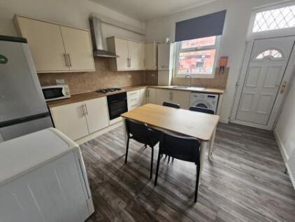 Bright and modern kitchen featuring a spacious ...