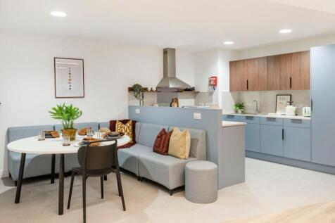 Bright, modern open-plan kitchen and dining are...