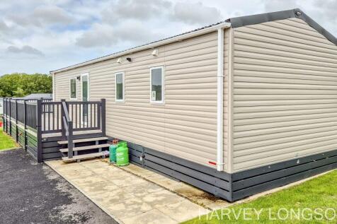 Side exterior of ABI Amberley holiday home with pr