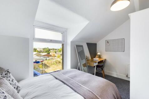 Charming double bedroom featuring ample natural...