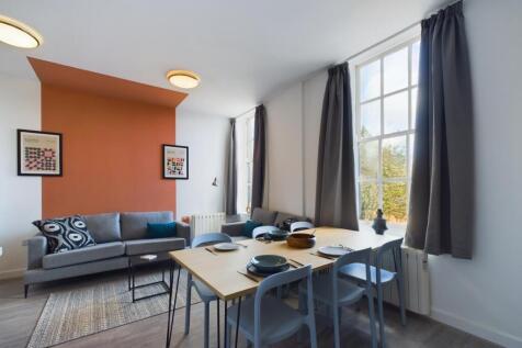 A spacious and stylish modern living room, perf...