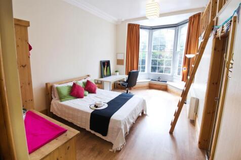 Bright master bedroom with large bay window....