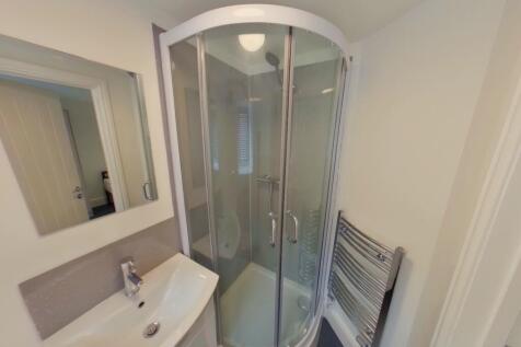 A modern and clean bathroom featuring a stylish...