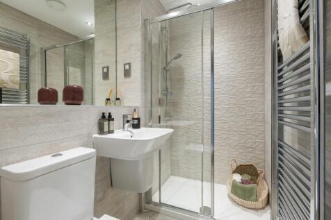 The main bedroom boasts an en-suite shower room