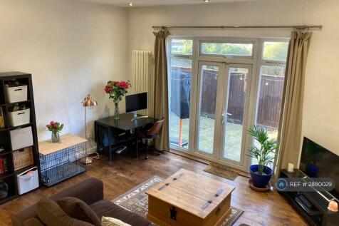 Large Lounge/Dining Room With High Ceilings