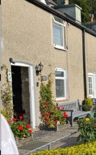 Solid TIMBER DOOR leads into:-