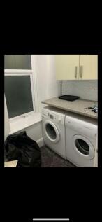 Bright utility space with laundry facilities...