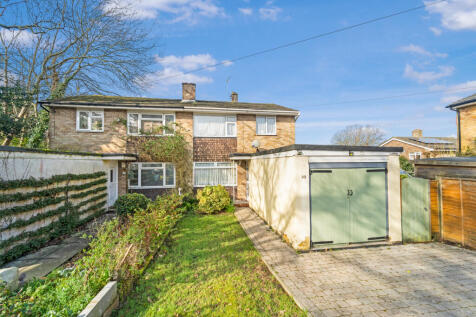 Front elevation with driveway providing parking for up to 4 vehicles