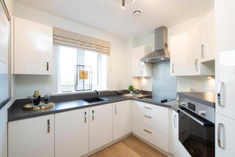 a kitchen with white cabinets