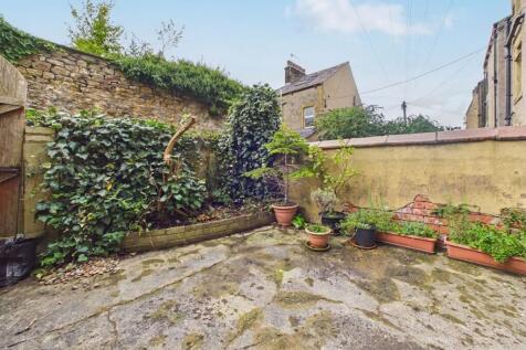 Enclosed Rear Yard with Sheltered Seating Area