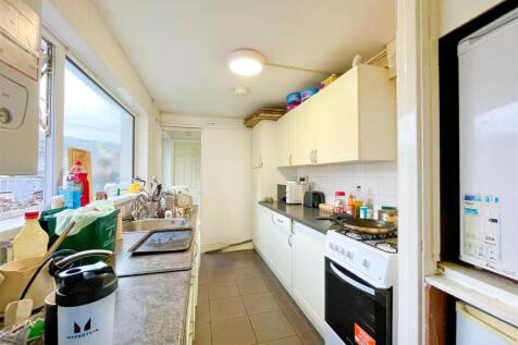 Bright kitchen with ample storage and appliance...