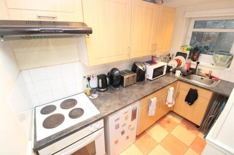 Fully equipped kitchen with ample storage space...